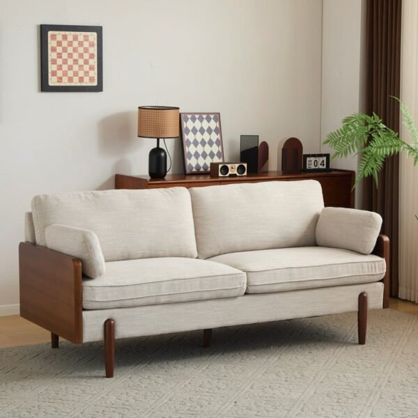 Slim arm beige sofa styled with rug and center table