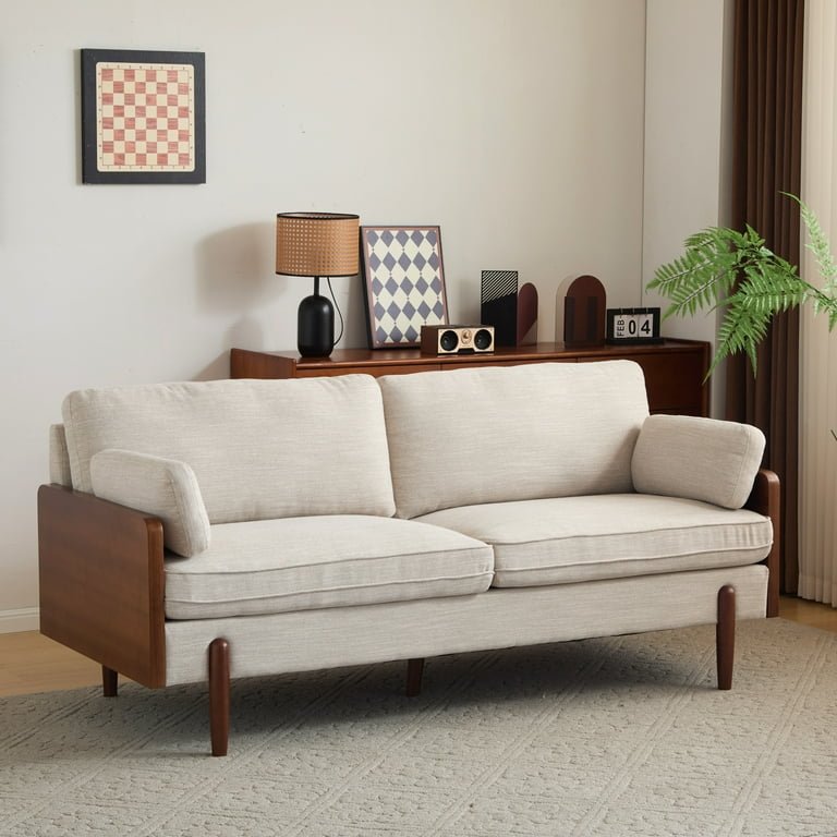 Slim arm beige sofa styled with rug and center table