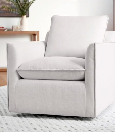 Upholstered armchair with high back and rolled arms